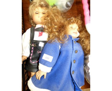 A Heidi Ott girl doll in blue coat; a Götz girl puppet doll in lederhosen; a Roddy black baby doll