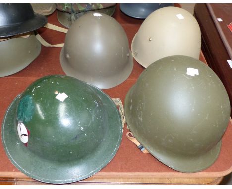 A US MI post WWII steel helmet and 3 others