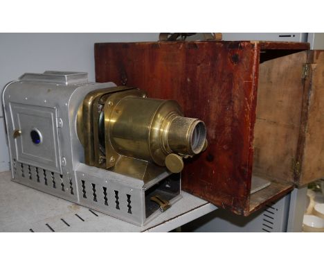 A brass and silvered metal "Helioscopic Lantern" on wooden box, with slides