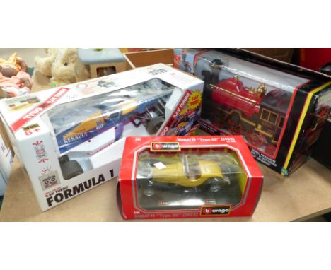 A boxed battery operated Steam Engine, a boxed Buaago Bugatti Type 55 and a boxed Tyco R/C Formula One remote control car