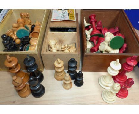 A stained red and white bone chess set in wooden box, height of king 3½"; a Staunton style chess set; and another ( may not b