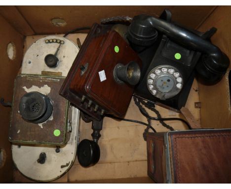 A General Electric Co Ltd wall telephone; a similar period telephone with handset; a post war black Bakelite telephone