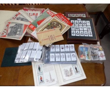 A selection of cigarette cards in albums; an album of cricket trade cards; 2 framed sets of county cricketers cigarette cards