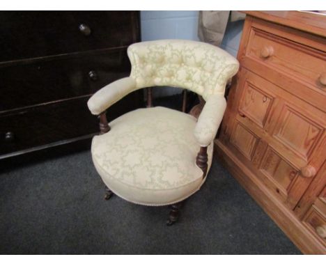 A Victorian walnut armchair, button back with padded arms over upholstered seat, turned supports, castor feet