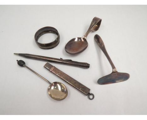 A quantity of silver items including napkin ring, coffee bean teaspoon and sterling propelling pencil