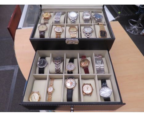 A two tier watch display box containing an assortment of wristwatches, Swatch, Omega, etc (19)