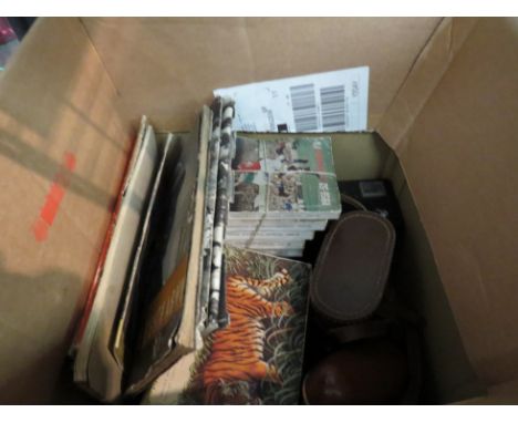 A box containing mixed goods; cigarette/tea card albums, vintage cameras (3), a cased set of chess glasses, etc