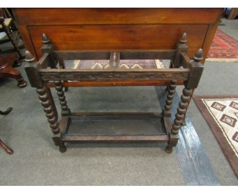 An early 20th Century oak and barley-twist umbrella and stick stand, 71cm x 76cm x 26cm