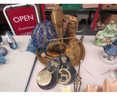 A selection of brassware including a charger, jug with ship design and gong together with a blue beaded ceiling light shade i
