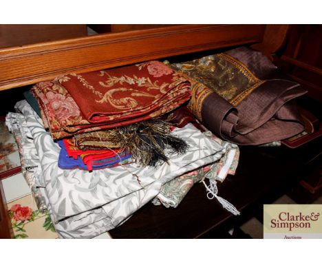 A quantity of various fabrics, curtains, wall hangings etc.