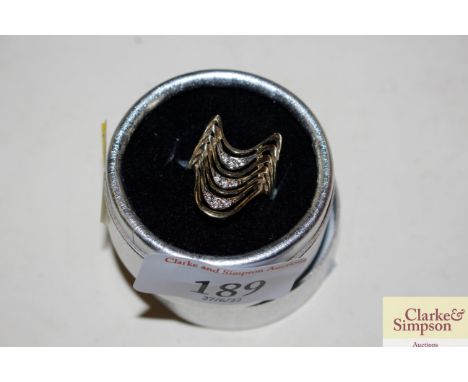 A yellow metal and white metal 585 ring, 4gms