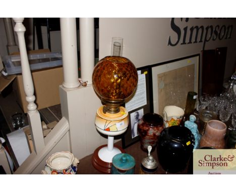 A Veritas Lampworks Art Deco oil lamp with amber glass shade 