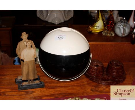 A Bakelite ink stand; a plastic ice bucket; and a pair of printed mantelpiece figures 