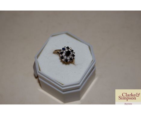 A 9ct gold blue and white stone set ring 