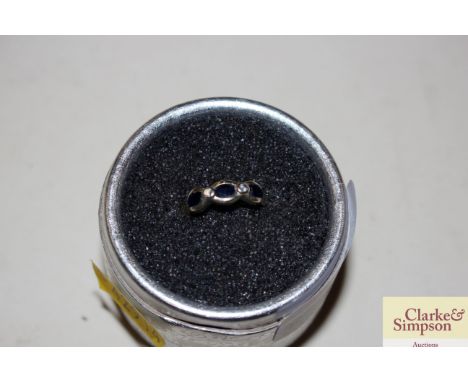An 18ct gold ring set sapphire and diamonds, 3gms