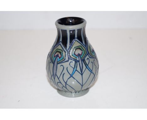 Moorcroft vase in the Peacock Parade pattern, height 10cm