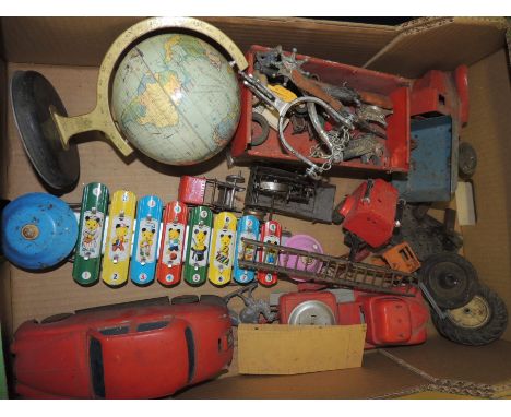 A quantity of assorted toys including a small Chad Valley globe; some Western sheriff's stars, spurs and small guns; tinplate