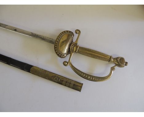 An Elizabeth II dress rapier by Wilkinsons, having brass stirrup hilt, etched blade and in original brass mounted black leath