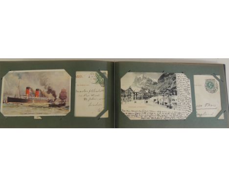 An album of approx 98 assorted postcards, each page cut to reveal the postmarks, and including photo topo; chromo litho; Crie