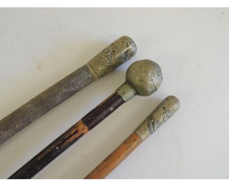 A Somerset Light Infantry malacca swagger stick; a Dorsetshire Regt. bamboo swaggerstick and a Royal Artillery horse whip (3)