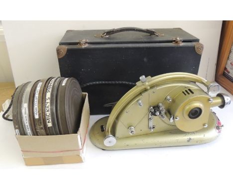 A Pathescope Gem 9.5mm projector in box together with 5 reels of Pathe film - cartoon including Mickeys Steamroller, c.1952