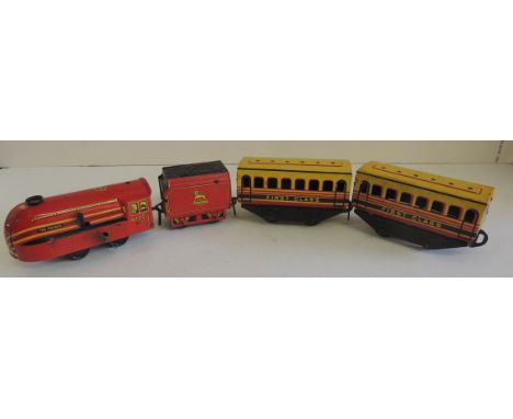 A Brimtoy tinplate clockwork train comprising streamlined loco "The Prince" and tender, BR and two First Class coaches ++slig