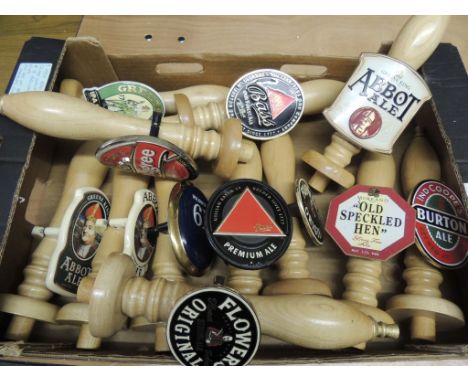 Twelve wood beer pump handles, nine with metal beer clips (2 duplicates) and three with ceramic clips (12)