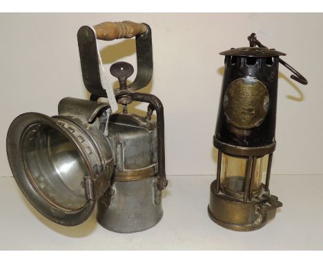A miners lamp with brass plate for "The Protector Lamp and Light Co." and numbered "68" 23.5cms high together with a hand-hel