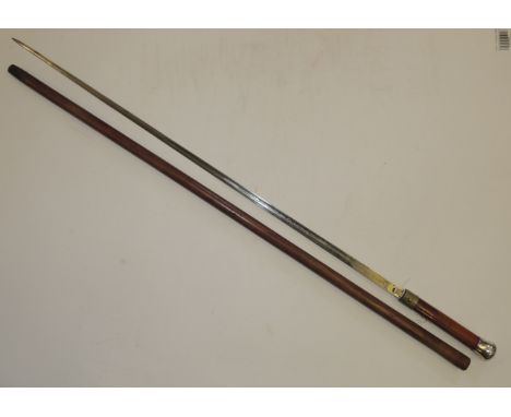 A Victorian swordstick with "Toledo" tapering single edge blade with etched foliate decoration, silver pommel top hallmarked 