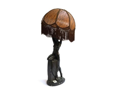 A large 20th century figural nude table lamp, with tasseled shade, 76cmH including shade