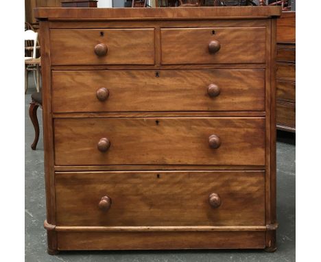 A 19th century light mahogany veneer chest of two short over three long drawers, turned wooden knobs, bears plaque for Willia