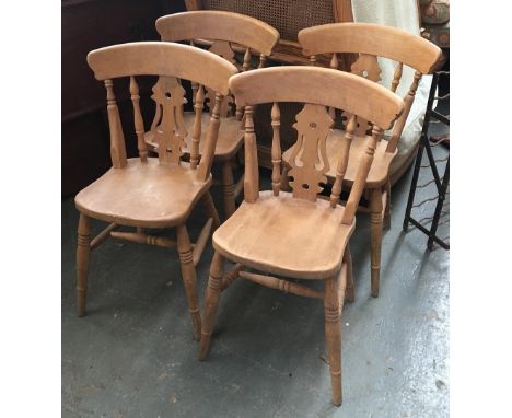 A set of four splatback beech kitchen chairs, with shaped seats on ring turned legs and H stretchers 