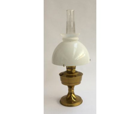 A brass 'Aladdin' oil lamp with milk glass shade and chimney 