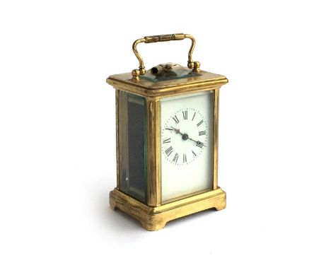 A French gilt metal mantel clock with key, enamel dial with roman numerals, 11cmH 