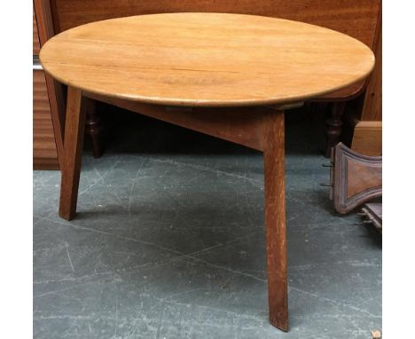 A light oak cricket style table, 67cmD 47cmH 