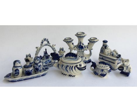 A collection of Russian Gzhel and other blue and white ceramics, to include cruet set, candlestick, fish figures etc 