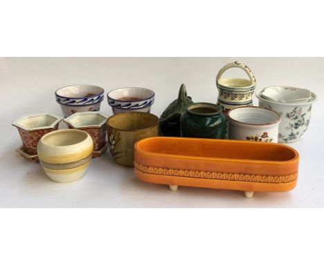 A collection of ceramic planters by various makers 