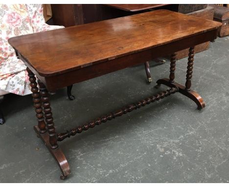 A 19th century rosewood writing table, on bobbin turned supports and stretcher, with ceramic casters, 122x60x70cmH 