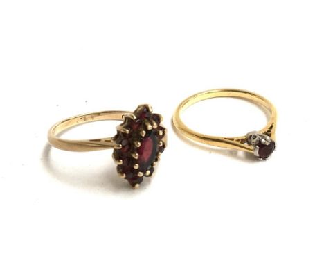 9ct gold dress ring set with one central oval garnet surrounded by tiny garnets, size Q, gross weight 2.6g together with one 