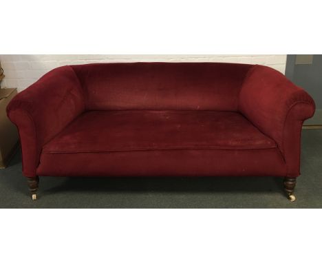 A Chesterfield style sofa, on turned legs and ceramic casters, approximately 180cm wide