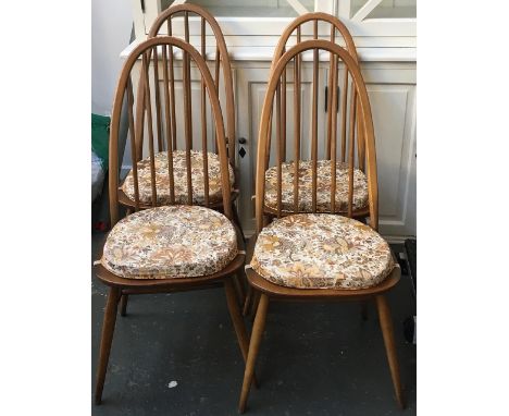 A good set of four Ercol stickback kitchen chairs, each with loose squab cushion 