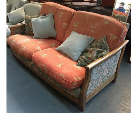 An Ercol light oak three seater bergere style sofa, 190cmW 