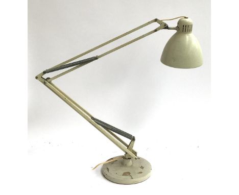 A large white anglepoise lamp, on circular base 