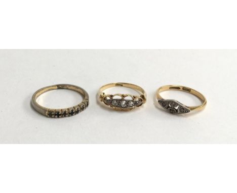 18ct gold ring set with 4 small diamonds in  a pretty openwork setting size N  gross weight 2.4g together with an 18ct marcas