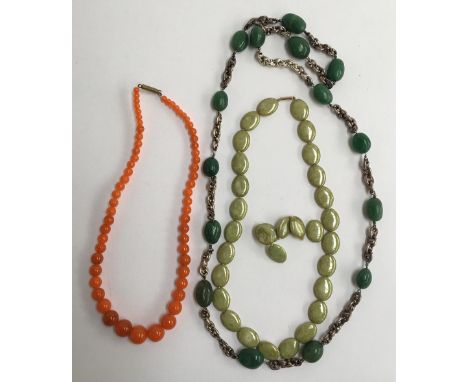 Three bead necklaces, one jade, another olive green agate with a gold clasp and a further set of orange beads 