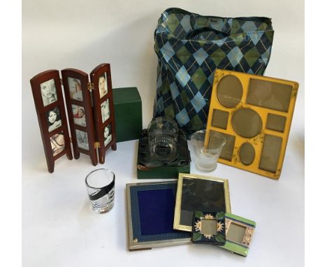A mixed lot to include enamel photo frames; together with various others; several items of glassware including a cased tumble