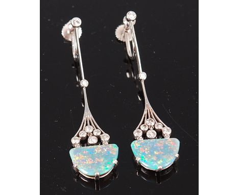 A pair of Art Deco platinum, diamond and opal set ear pendants, arranged as five claw set half-oval opal on a spray of six il