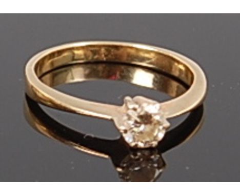 An 18ct gold diamond solitaire ring, the claw set brilliant weighing approx 0.25ct, 2.3g, size K