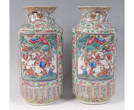 A pair of 19th century Chinese famille rose vases, each enamel decorated with opposing reserves of battle scenes and ceremoni