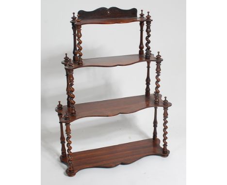 A Victorian rosewood four tier wall shelf, of small size, on spiral turned columns, h.66cm, w.49cm